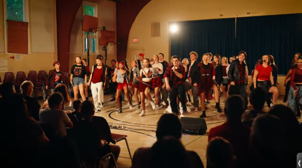 Students singing and dancing